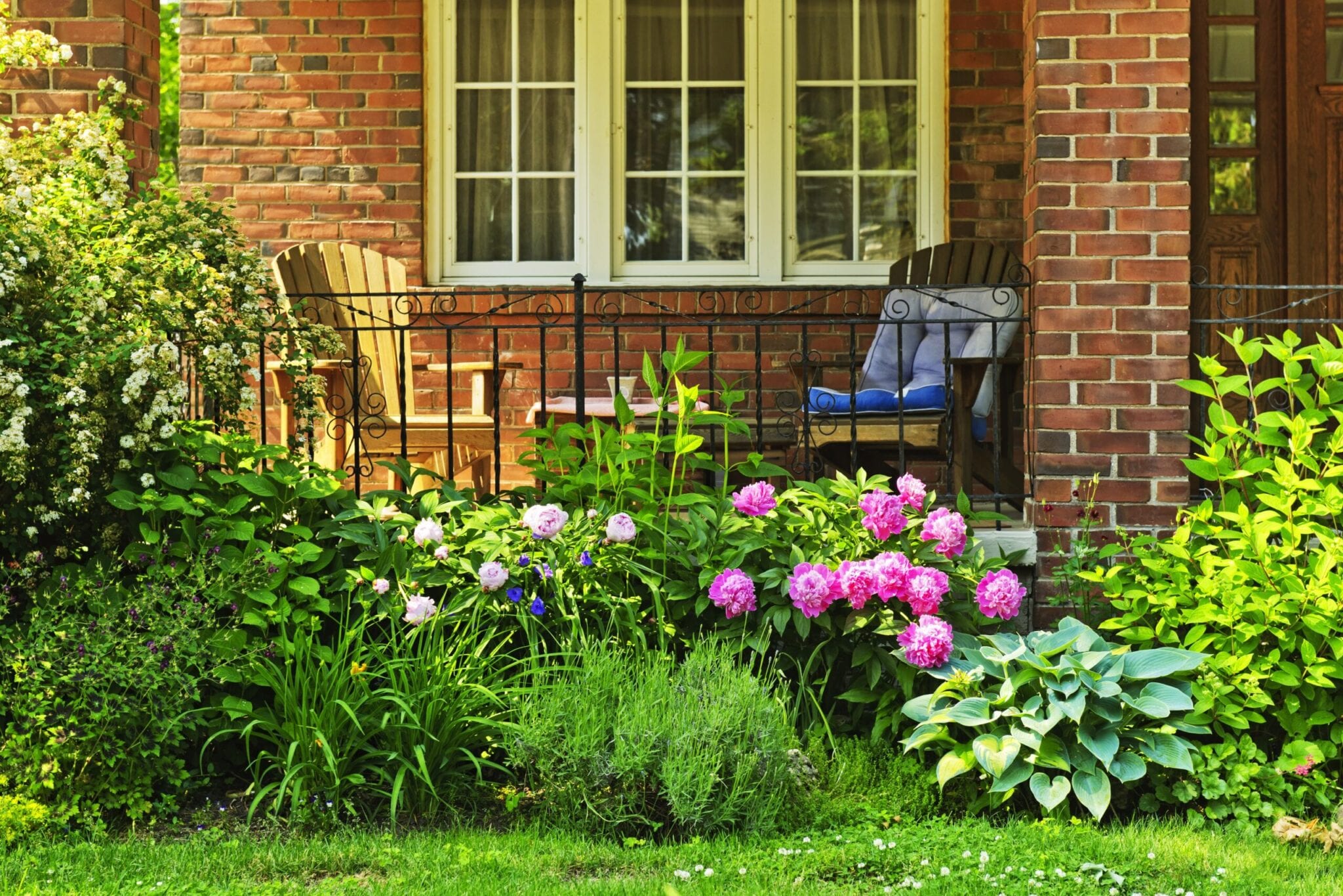 11930076 - front of home with chairs and flower garden